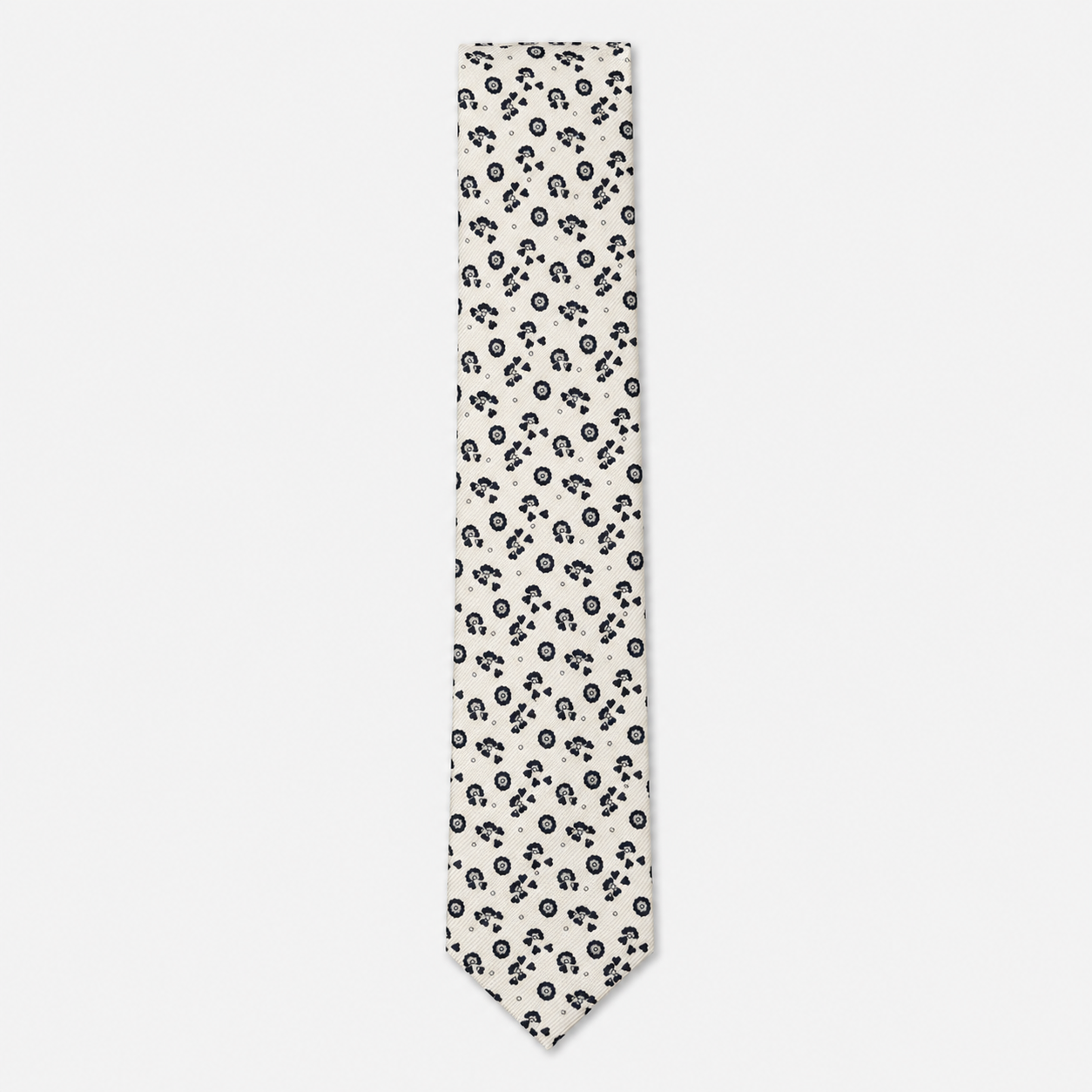 The Foggia Tie – ivory and black floral paisley silk tie on a light grey background