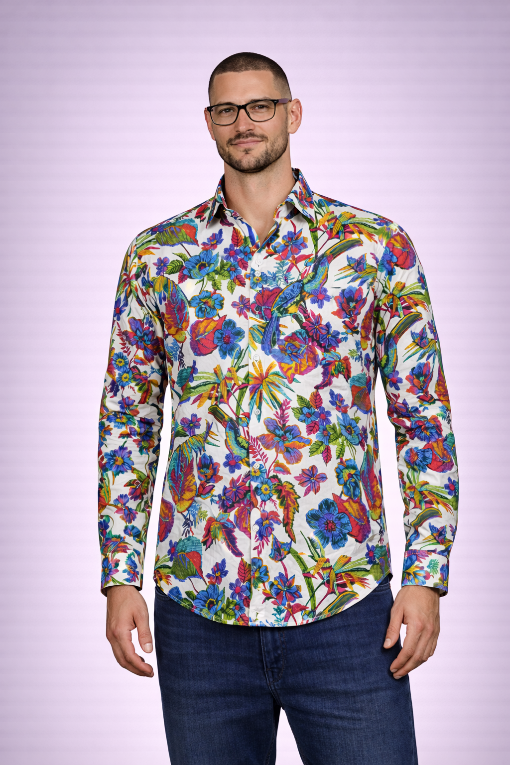 Man wearing a colorful floral shirt against a light purple background