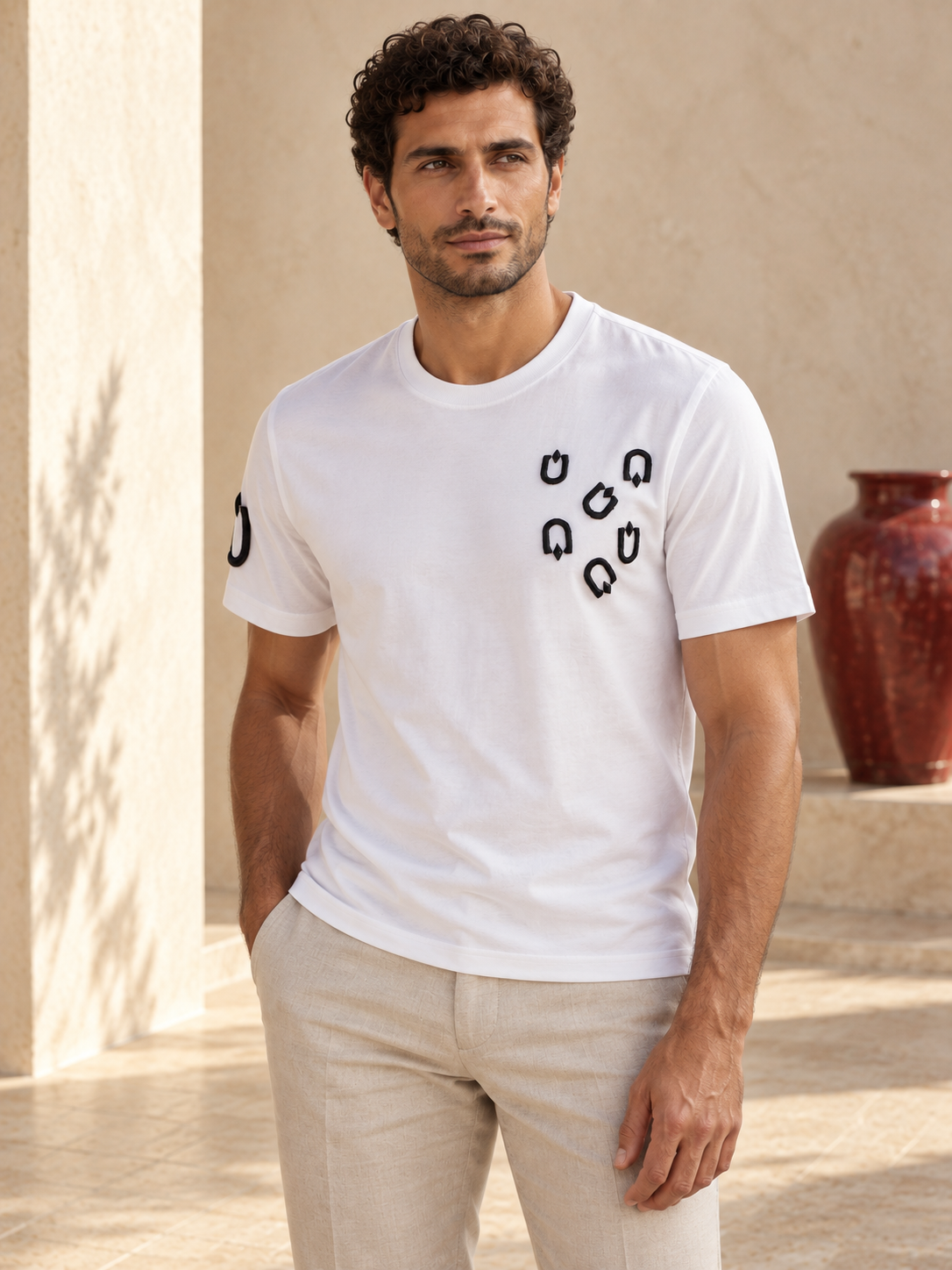 Model wearing Fine Cotton T-shirt with Multi U Embroidery White