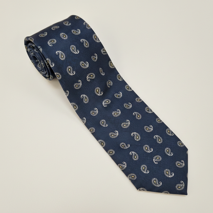 The Roma Tie - silk tie laid flat on light grey background