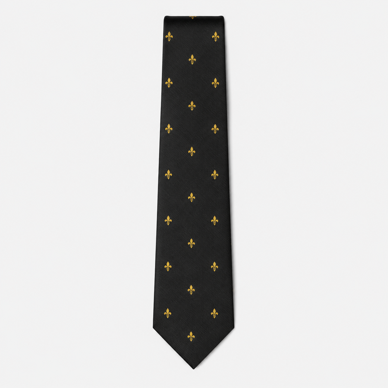 The Aosta Tie – black and gold fleur-de-lis silk tie on a light grey background