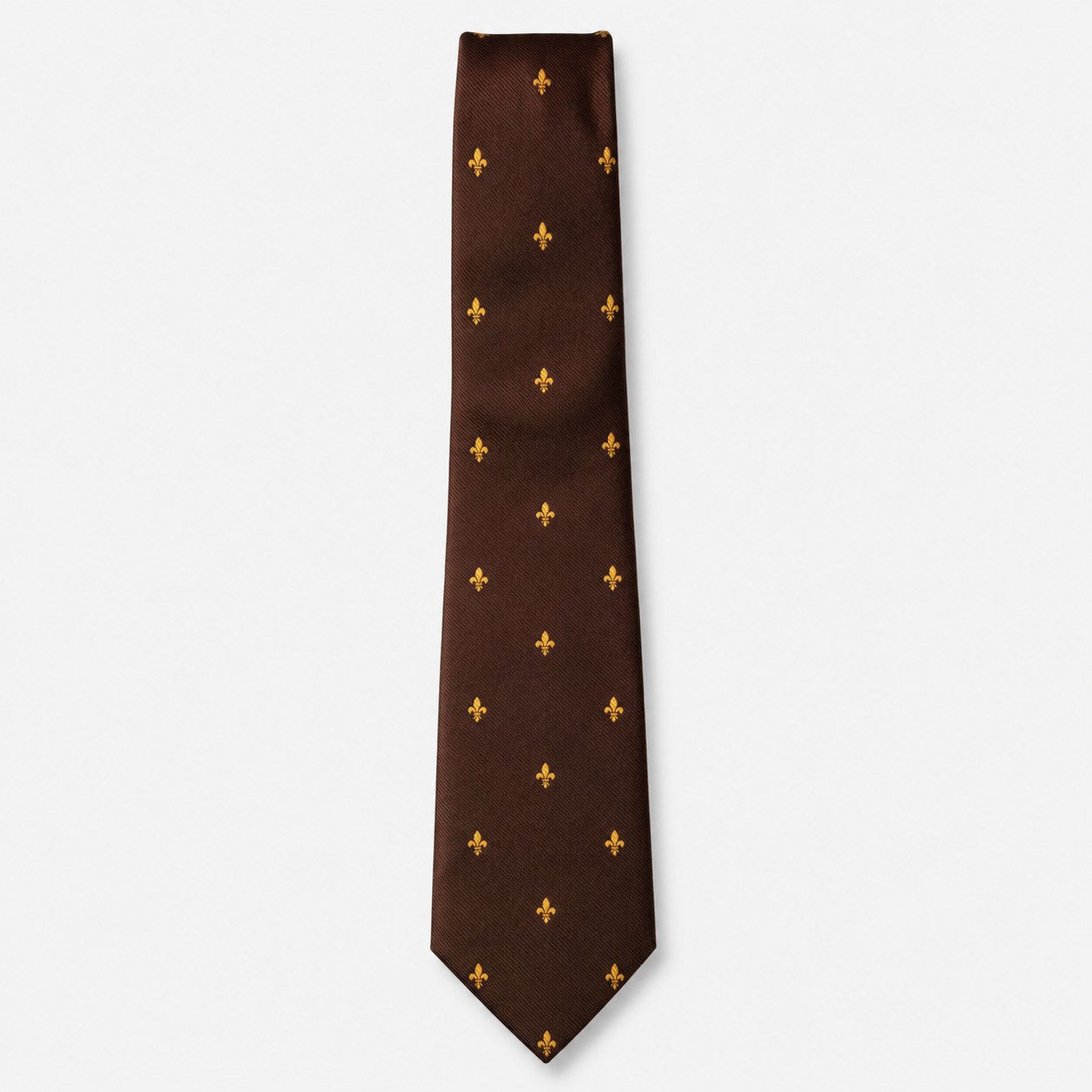 The Bari Tie – brown and gold fleur-de-lis silk tie on a light grey background