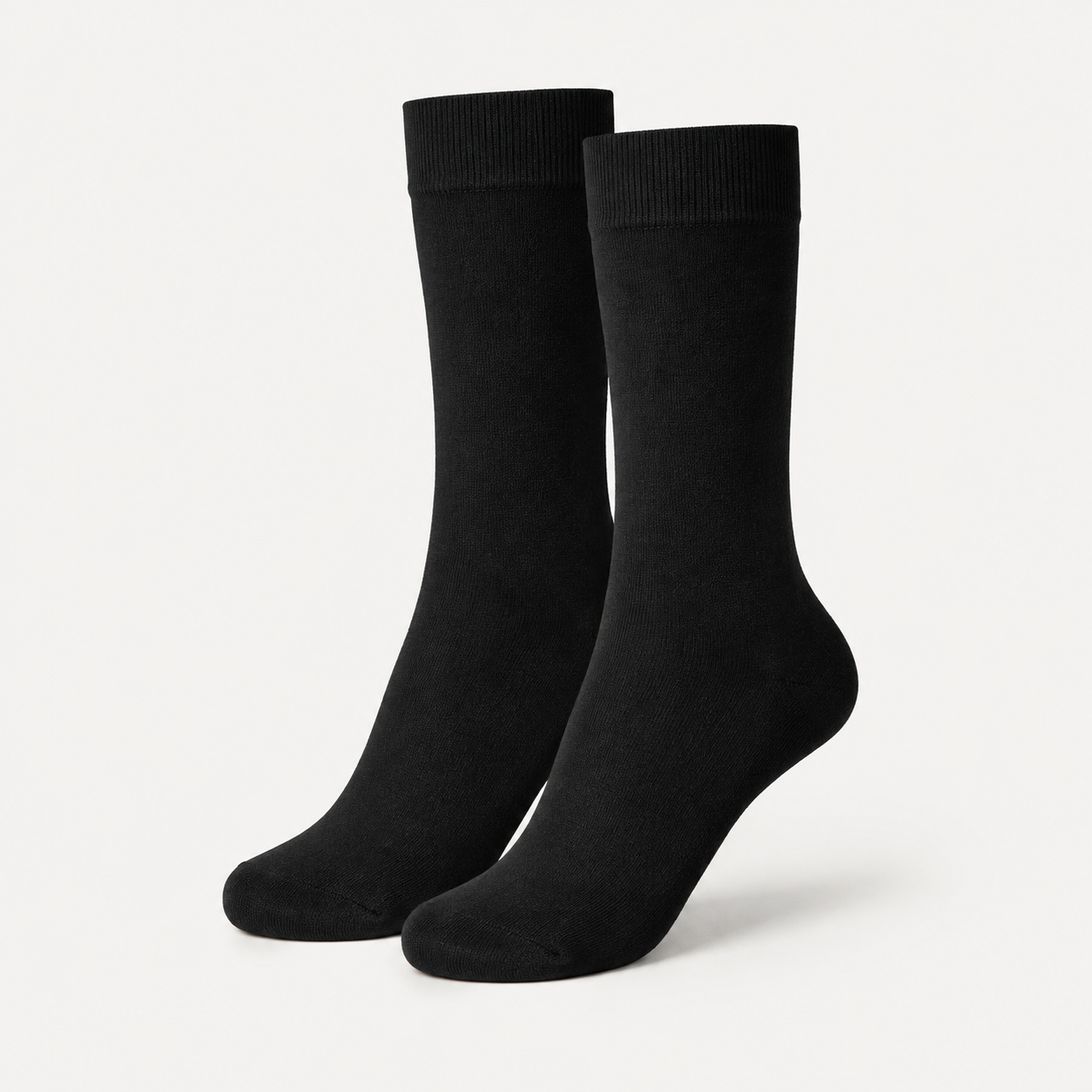 Black dress socks by URBBANA on a light grey studio background
