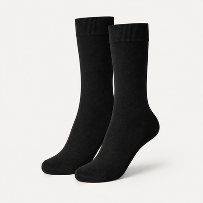 Black dress socks by URBBANA on a light grey studio background