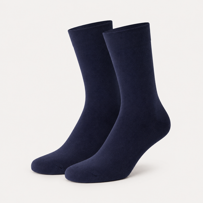 Blue dress socks by URBBANA on a light grey studio background
