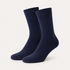 Blue dress socks by URBBANA on a light grey studio background