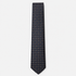The Bolzano Tie – navy, gold and rust micro medallion silk tie on a light grey background