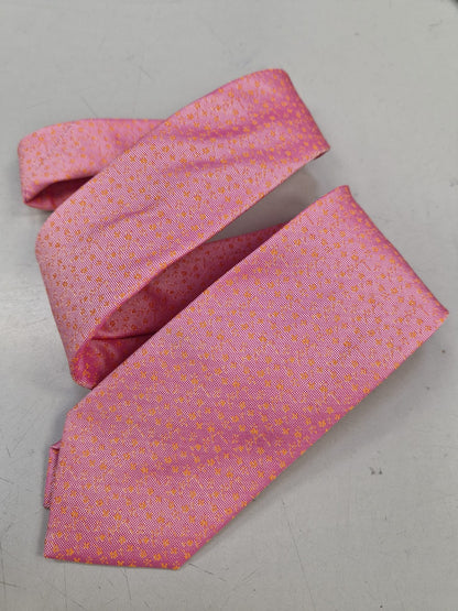 Bright pink textured silk tie, loosely folded.
