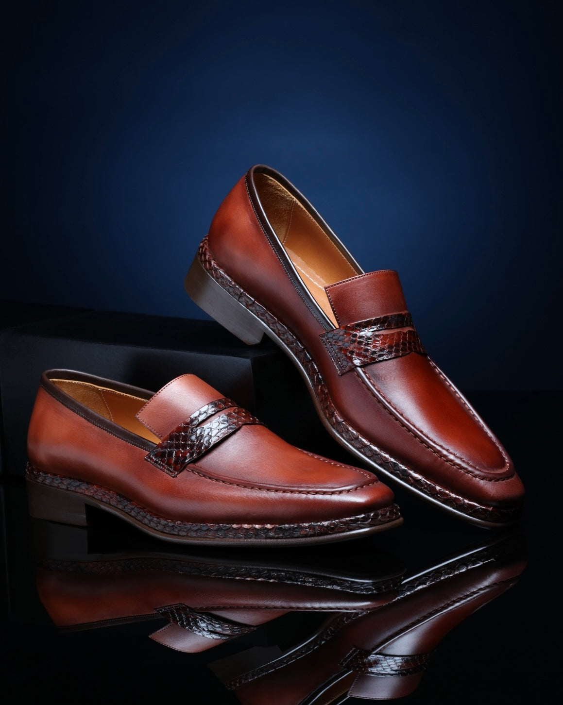 URBBANA cognac python-skin penny loafers.