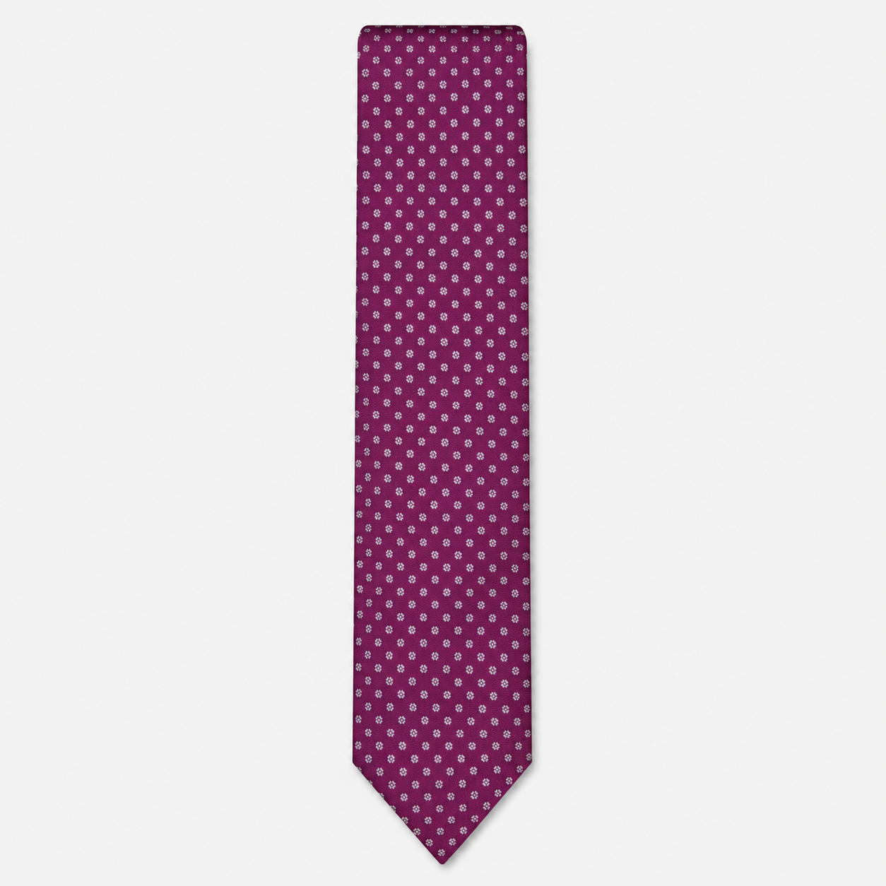 The Cremona Tie – magenta and white micro dot silk tie on a light grey background