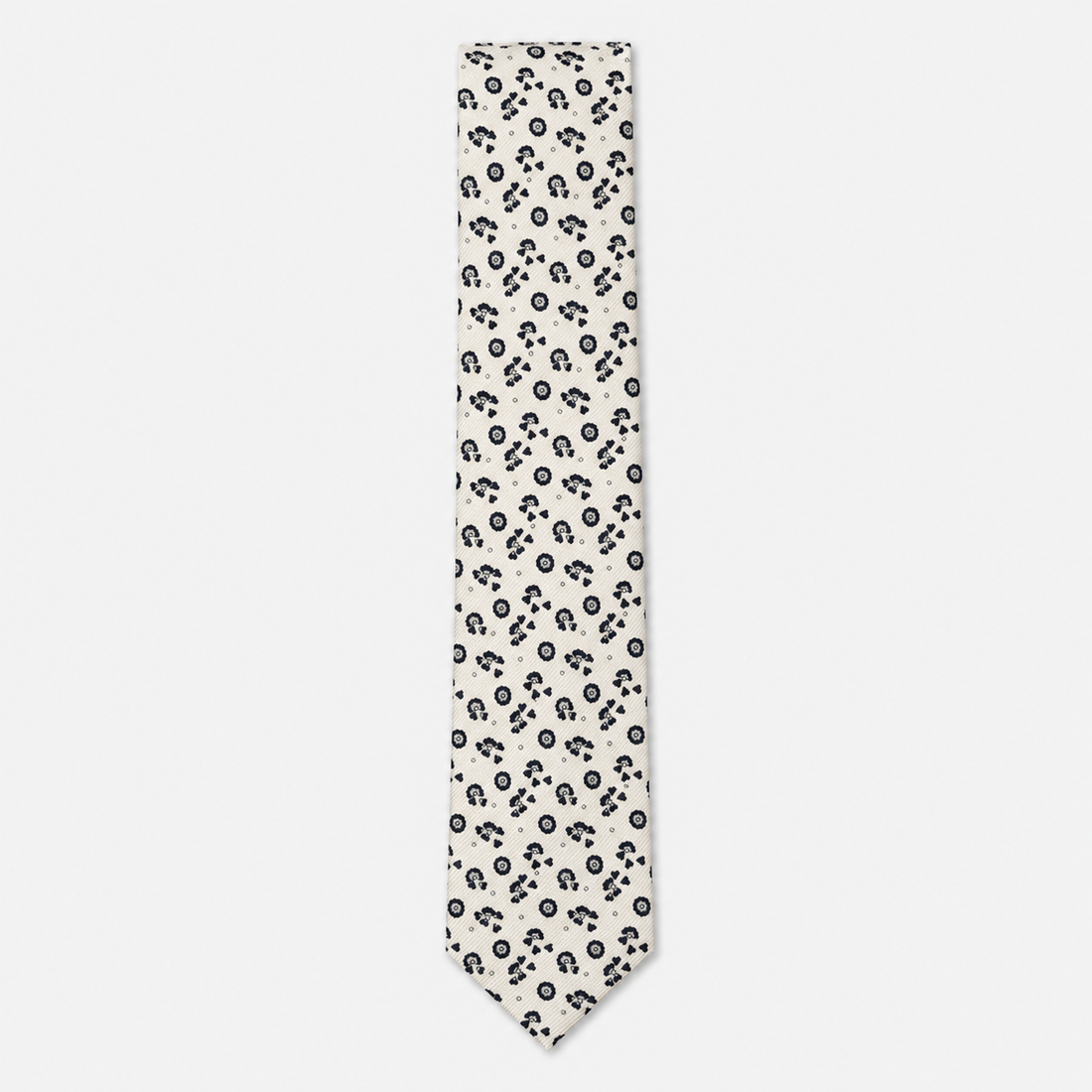 The Foggia Tie – ivory and black floral paisley silk tie on a light grey background