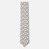 The Foggia Tie – ivory and black floral paisley silk tie on a light grey background