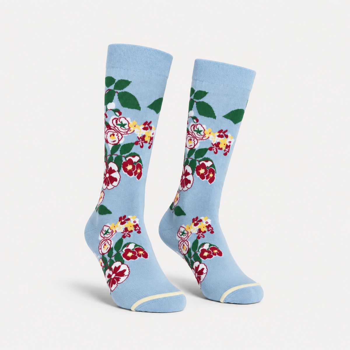 Paradis floral dress socks by URBBANA on a light grey studio background