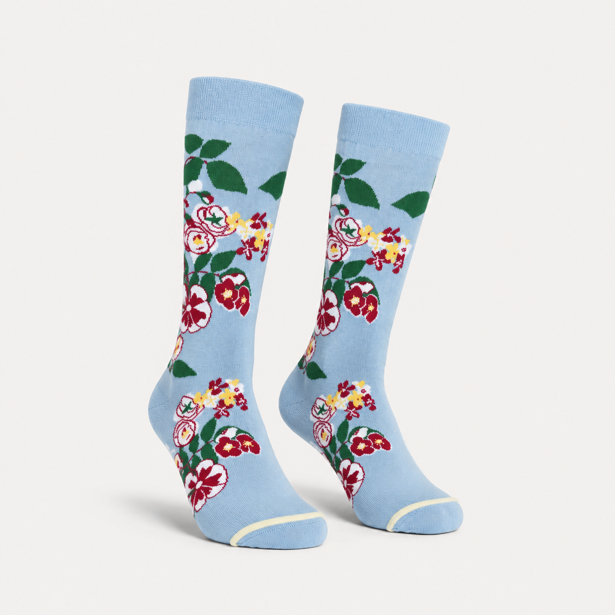 Paradis floral dress socks by URBBANA on a light grey studio background