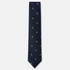 The Salerno Tie – navy and gold fleur-de-lis silk tie on a light grey background