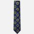 The Siracusa Tie – royal blue, gold and teal floral medallion silk tie on a light grey background