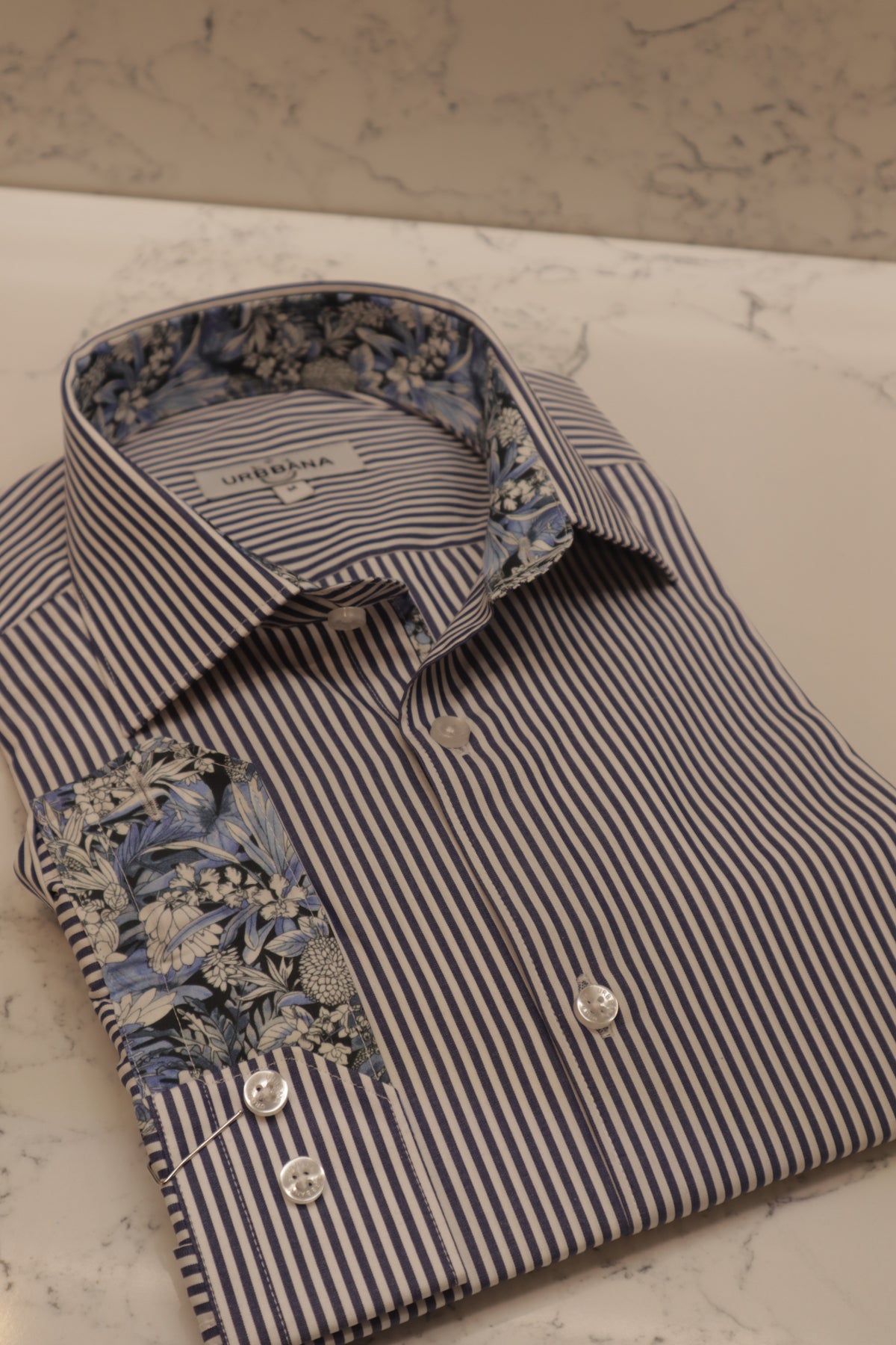 URBBANA white shirt with blue stripes.